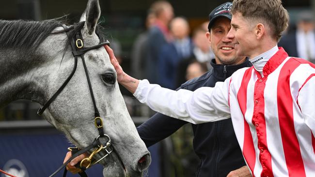 Jye McNeil gives Right To Party a pat after winning the Aurie's Star Handicap. Picture: Vince Caligiuri/Getty Images