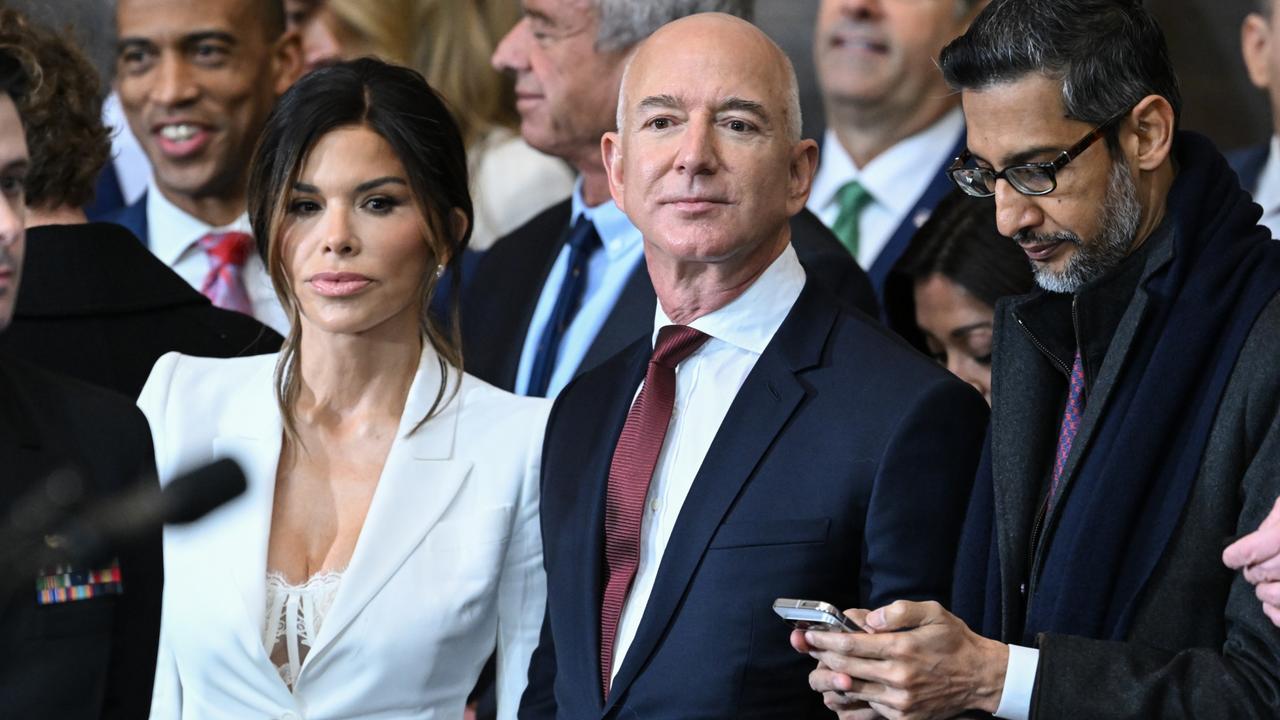 Jeff Bezos’ fiancee, Lauren Sanchez (left), turned heads at Trump’s inauguration in a white blazer that unapologetically revealed her underwear, sparking a storm of chatter online. Picture: Saul Loeb-Pool/Getty Images