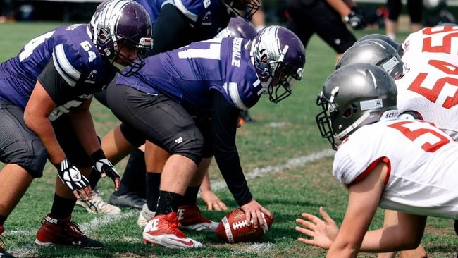 Defensive end Jobe Tuafale (ball in hand).