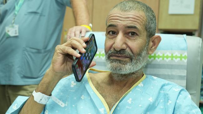 Kaid Alkadi talks on the phone after arriving for a check-up at the Soroka Medical Center in Beersheba. Picture: AFP.