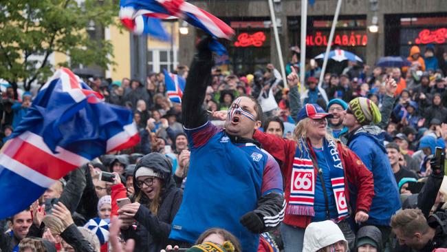 Iceland fans celebrate their side’s point against Argentina.