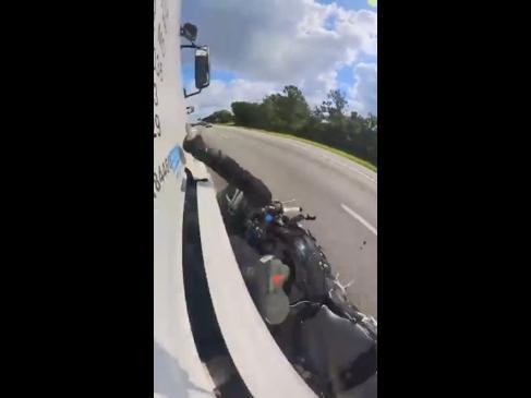 Rider hits two vehicles in crazy motorbike crash