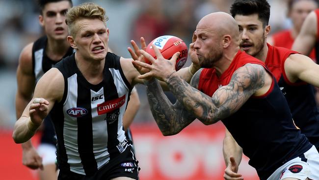 Adam Treloar tackles Nathan Jones during Round 23.