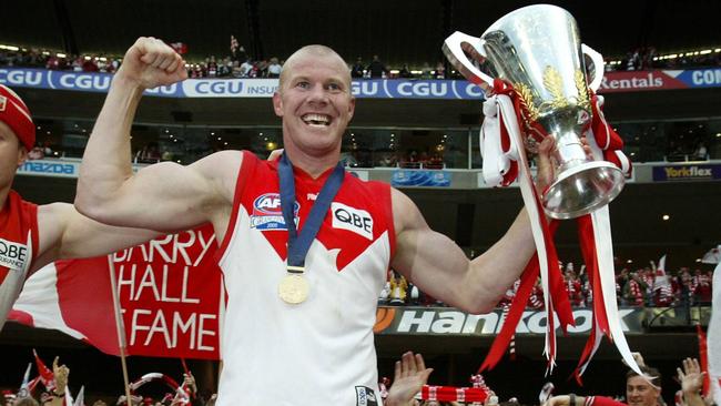 Barry Hall celebrates the 2005 premiership with Sydney supporters.