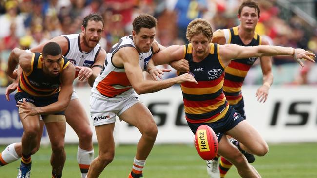 Josh Kelly of the Giants competes for the ball against Rory Sloane of the Crows.