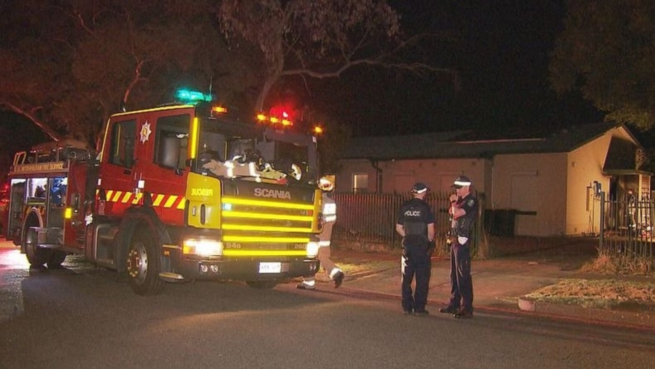 Firefighters and police at the scene of the blaze. Picture: Nine