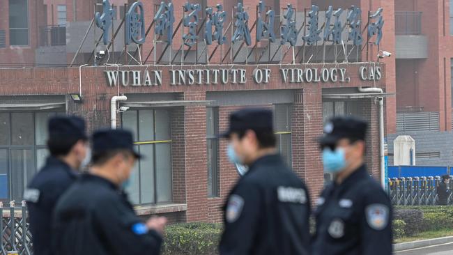 Security personnel stand guard outside the Wuhan Institute of Virology in Wuhan as members of the World Health Organisation (WHO) team investigating the origins of the COVID-19 coronavirus make a visit to the institute in February. Picture: AFP