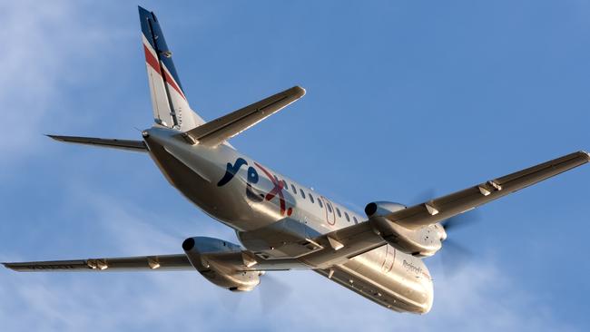 Adelaide, Australia - REX (Regional Express Airlines) Saab 340 twin engined regional commuter aircraft taking off from Adelaide Airport.Escape 15 October 2023Doc HolidayPhoto - iStock