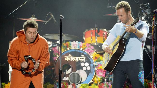 Liam Gallagher and Chris Martin perform Oasis hit ‘Live Forever’. (Dave Hogan via AP)