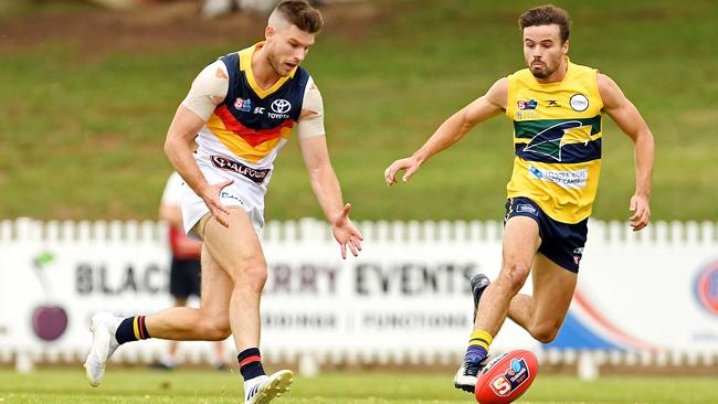 Bryce Gibbs leads Eagle Jordan Foote to the ball in the SANFL clash at Woodville Oval. Picture: TOM HUNTLEY.