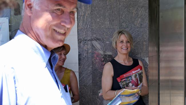 Mr Alexander and Ms Keneally hand out flyers outside the pre-polling office in Epping. Picture: Toby Zerna