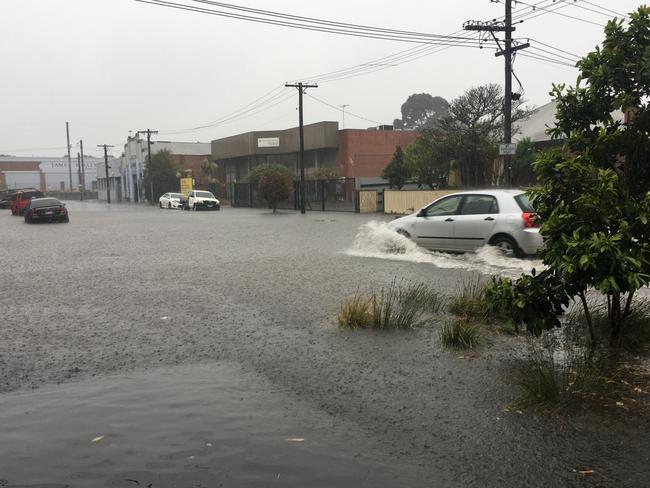 Flooding on the street on Melbourne Cup Day.