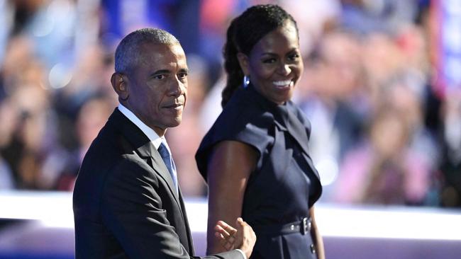 Former US president Barack Obama and his wife and former first lady Michelle Obama on stage at the Democratic National Convention. Picture: AFP