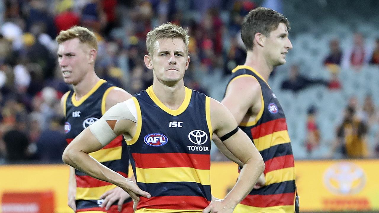 Tom Lynch, David Mackay and Josh Jenkins after the Round 1 loss to Hawthorn on Saturday. Picture: Sarah Reed.