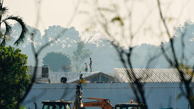 Three teenagers on the roof of Don Dale Detention Centre last year.