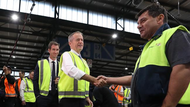 Bill Shorten with local candidate Sam Crosby talking to Rick Mileto at the Sydney Markets at Homebush. Picture: Kym Smith.