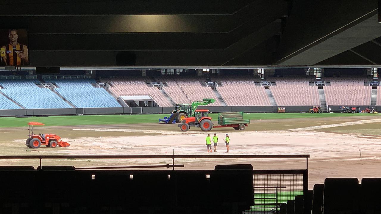 Parts of the MCG turf were replaced ahead of the AFL round 1. Tractors and workmen busy ripping up and replacing the MCG turf. Picture: David Caird