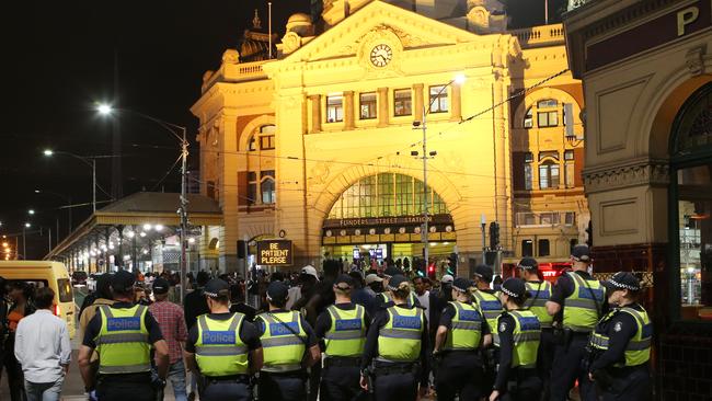 Police outside Flinders Street Station. Picture: David Crosling