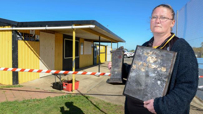 Aldinga Netball Club president Samara Bryant with one of the fire-damaged trophies. Picture: AAP / Brenton Edwards