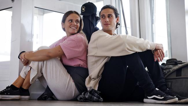 Travellers Julia Soler and Zenon Sanchez were waiting for a flight to Ballina on Saturday as the airport slowly returned to normal. Picture: Sam Ruttyn