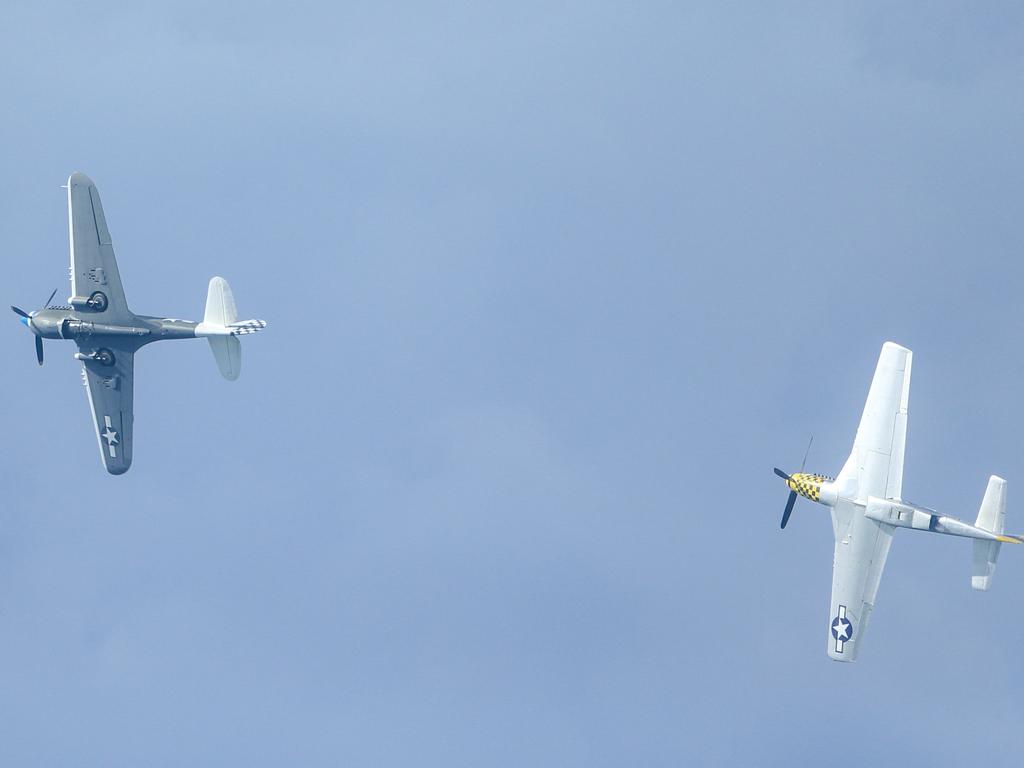 WW2 aircraft , the P-40 and P51 during the inaugural Pacific Airshow over Surfers Paradise on the Gold Coast. Picture: Glenn Campbell