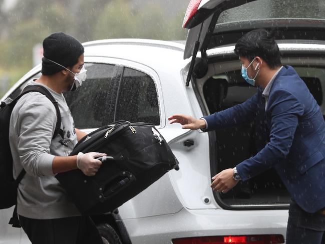 People wait in the express parking area for ubers ect at Sydney international airport .pic John Grainger