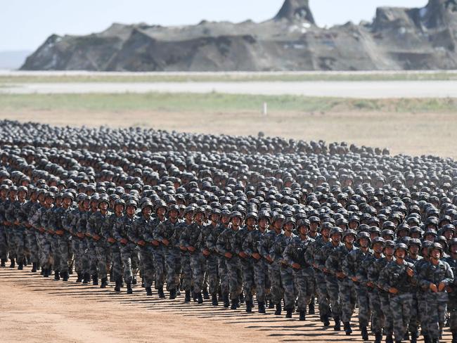 Chinese soldiers march in a July military parade at the Zhurihe training base in a display of military might. Picture: AFP