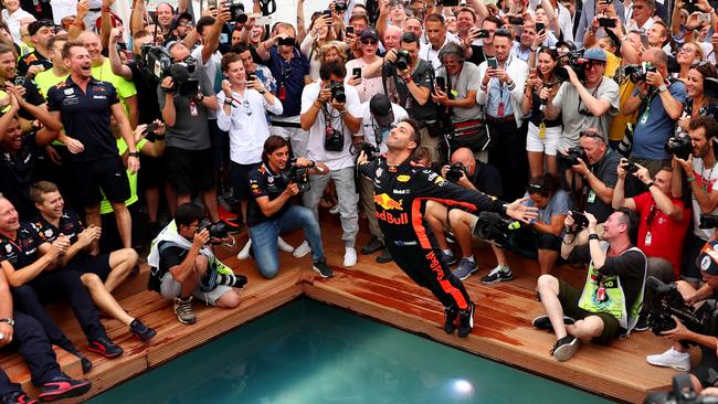 MONTE-CARLO, MONACO - MAY 27: Race winner Daniel Ricciardo of Australia and Red Bull Racing celebrates with a swan dive into the swimming pool of the Red Bull Energy Station after the Monaco Formula One Grand Prix at Circuit de Monaco on May 27, 2018 in Monte-Carlo, Monaco. (Photo by Dan Istitene/Getty Images)