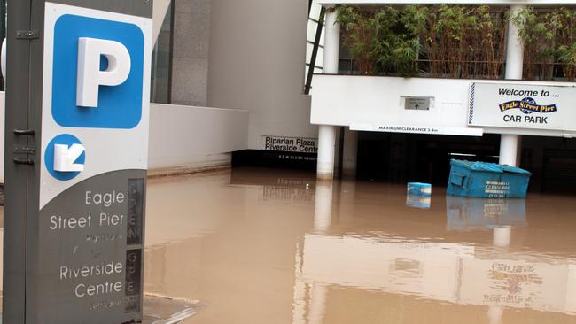January 2011: Flooded Eagle Street Pier Car Park. Picture: AAP Image/Rohan Noyes