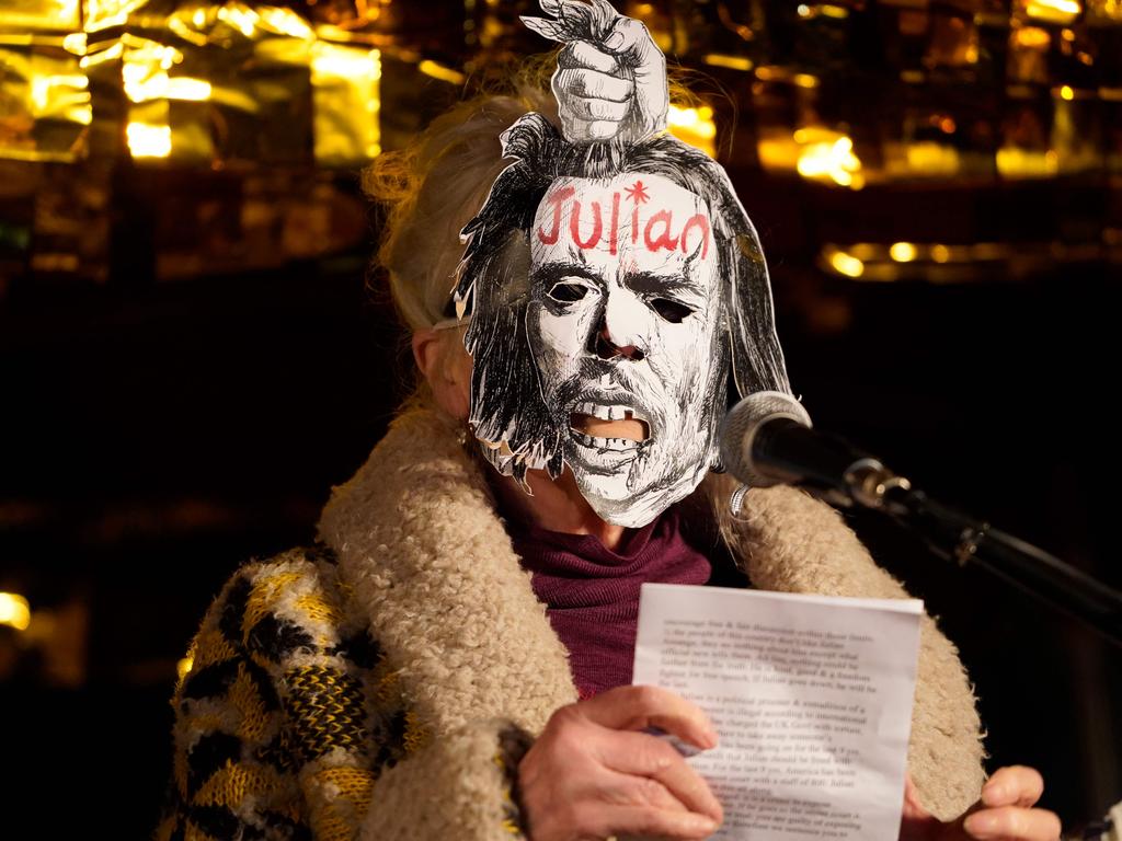 Fashion designer Dame Vivienne Westwood, wearing a mask, reads a statement during a protest against the extradition of WikiLeaks founder Julian Assange. Picture: AFP