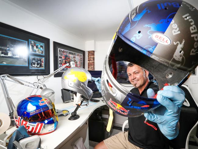 Antman Helmet Design owner Anthony Wolski has been painting helmets for the nation's top Supercar drivers since 2005. He has about 30 regular drivers, from Jamie Whincup to James Courtney, as clients. Anthony Wolski from Antman Helmet Design pictured holding V8 Supercar driver Shane Van GisbergenÕs helmet while he works on Jamie WhincupÕs ahead of the Bathurst 1000 and the Gold Coast 600 car races.Picture: NIGEL HALLETT