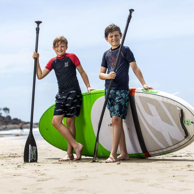 Dylan Prins (left) and Harper Soxsmith, both 11, enjoy a day at Port Douglas beach in far north Queensland. Picture: Sean Davey