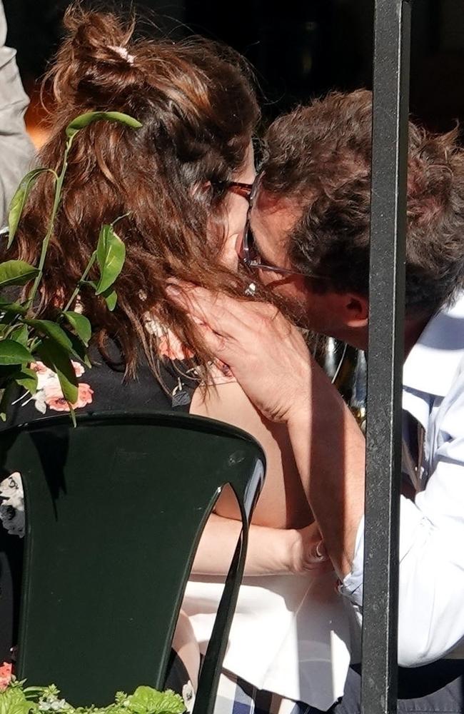 Dominic West kissing Lily James during an al fresco date in Rome. Picture: BACKGRID