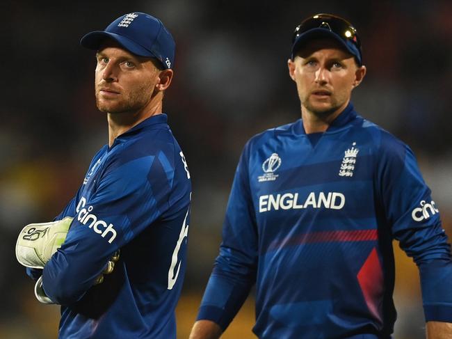 BANGALORE, INDIA - OCTOBER 26: Jos Buttler and Joe Root of England look on during the ICC Men's Cricket World Cup India 2023 between England and Sri Lanka at M. Chinnaswamy Stadium on October 26, 2023 in Bangalore, India. (Photo by Gareth Copley/Getty Images)