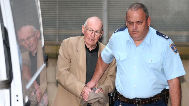 Former detective Roger Rogerson is led to a prison van in 2016. Picture: AAP