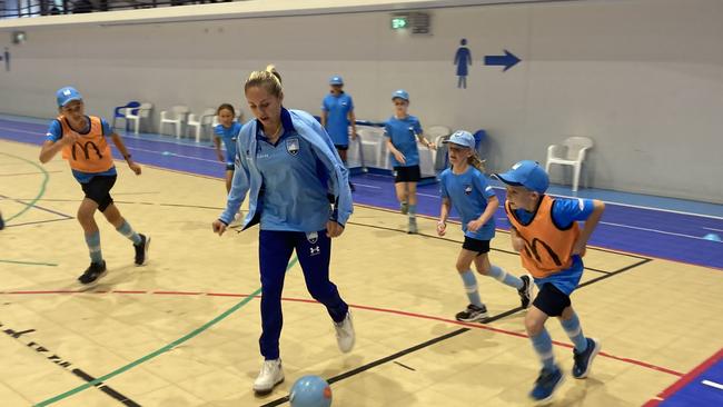 Sydney FC and Matildas midfielder Mackenzie Hawkesby joining in the action at a recent Sydney FC holiday clinic. Photo: Kevin Merrigan