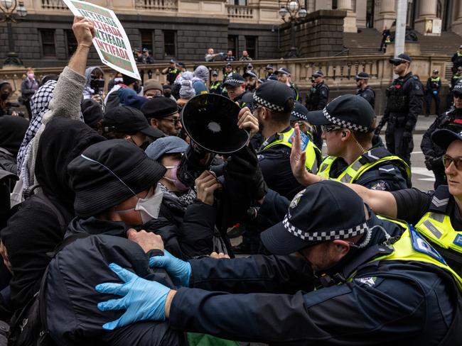 Pro-Palestine supporters clash with police on the steps of parliament. Picture: Getty