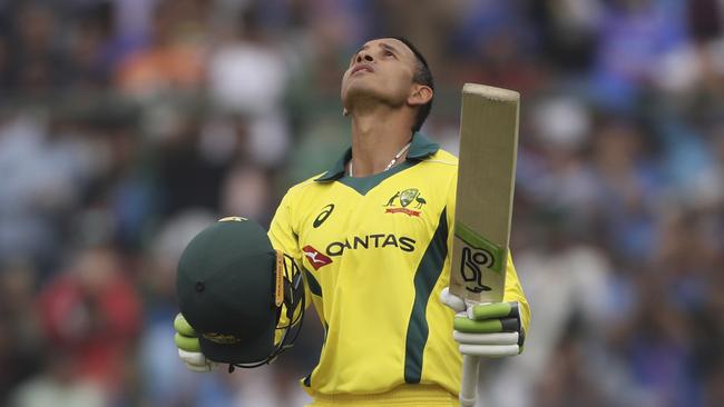 Australia's Usman Khawaja celebrates scoring a century during the final one day international cricket match between India and Australia in New Delhi, India, Wednesday, March 13, 2019. (AP Photo/Altaf Qadri)