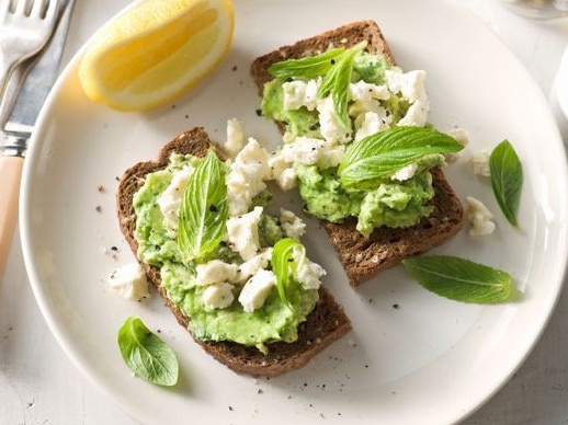 Avocado & feta smash on toasted rye.