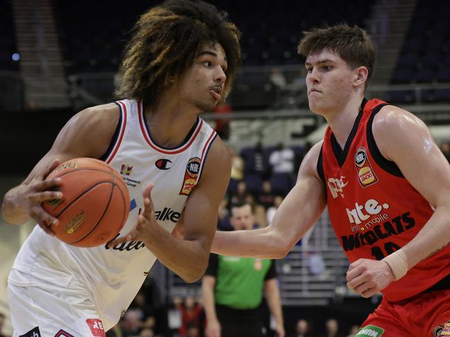 GOLD COAST, AUSTRALIA - SEPTEMBER 19: Trentyn Flowers of the 36ers dribbles the ball under pressure from Ben Henshall of the Wildcats during the 2023 NBL Blitz match between Perth Wildcats and Adelaide 36ers at Gold Coast Convention and Exhibition Centre on September 19, 2023 in Gold Coast, Australia. (Photo by Russell Freeman/Getty Images for NBL)