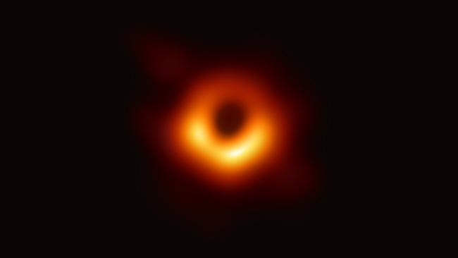 The 2019 photo of the black hole at the centre of M87, silhouetted by hot gas swirling around it under the influence of strong gravity. Picture: National science Foundation via Getty Images.