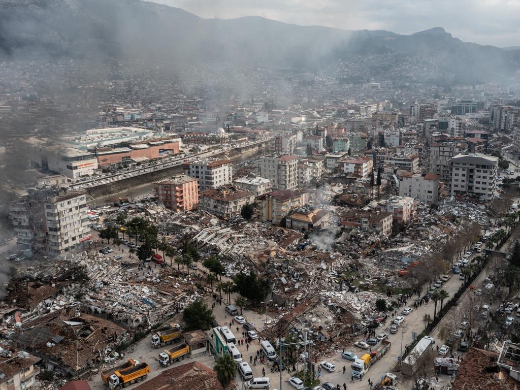 Smoke billows from the scene of a collapsed buildings in Hatay, Turkey. Picture: Burak Kara/Getty Images