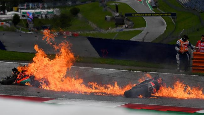 The burning motorbikes lie on the Red Bull Ring racetrack in Spielberg, Austria. Picture: AFP