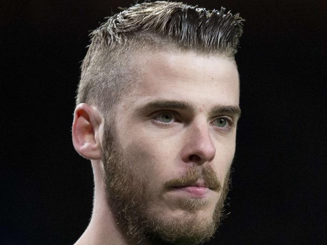 (FILES) In a file picture taken on March 9, 2015 Manchester United's Spanish goalkeeper David de Gea looks on during the FA Cup quarter-final football match between Manchester United and Arsenal at Old Trafford in Manchester, north west England. Spanish goalkeeper David de Gea has signed a new four year contract with Manchester United, keeping him at Old Trafford until at least 2019, less than two weeks after the Spain goalkeeper was on the verge of joining Real Madrid, the club announced on September 11, 2015. AFP PHOTO / OLI SCARFF RESTRICTED TO EDITORIAL USE. No use with unauthorized audio, video, data, fixture lists, club/league logos or “live” services. Online in-match use limited to 45 images, no video emulation. No use in betting, games or single club/league/player publications.