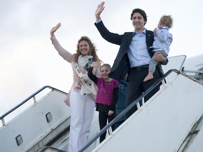It's one of the first international forums for new Canadian Prime Minister Justin Trudeau. Pictured with his wife Sophie Gregoire-Trudeau and children Hadrien and Ella-Grace. Picture: Adrian Wyld/The Canadian Press via AP.