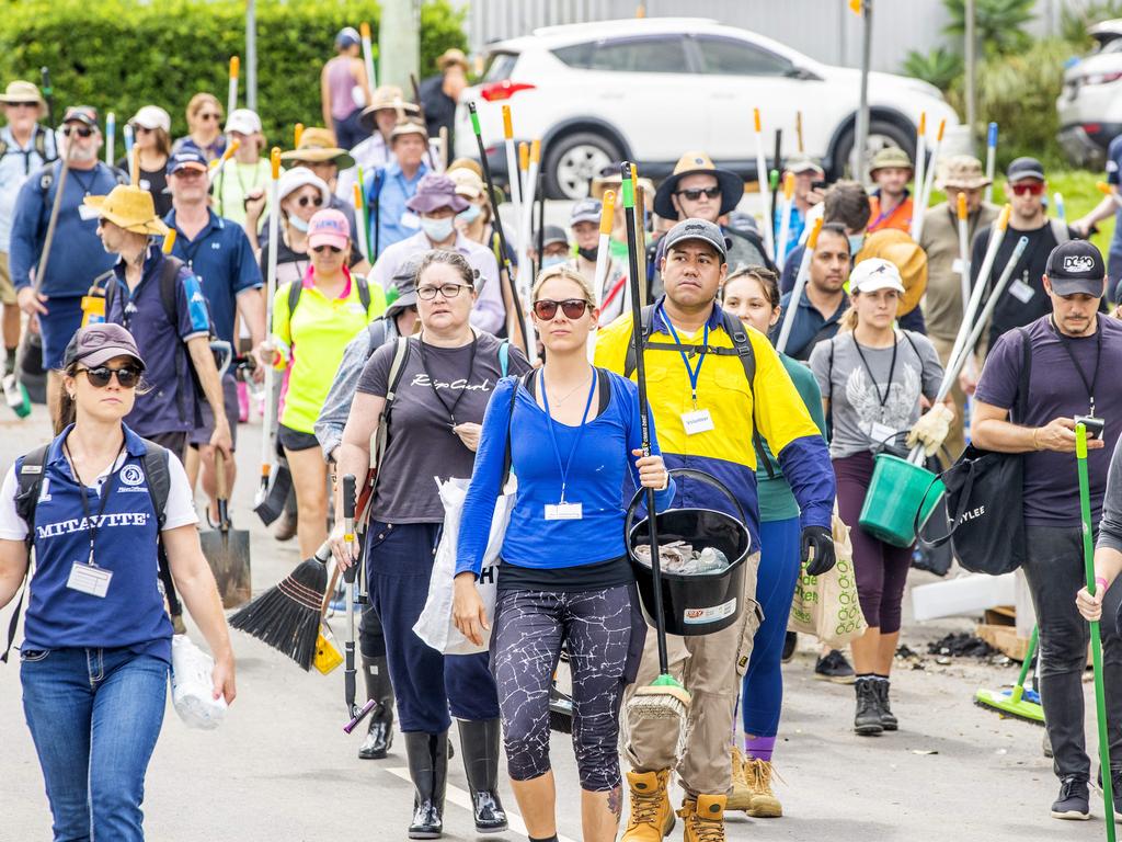 The Mud Army 2.0 arriving in Auchenflower after flooding in the suburb. Picture: Richard Walker