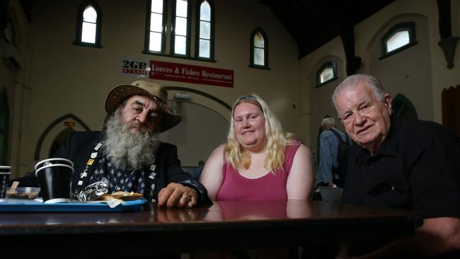 Homeless resident Joe Karadjian, 61, with Kristen Bakers, 33, and Reverend Bill Crews at breakfast at Loaves and Fishes. Picture: Britta Campion / The Australian