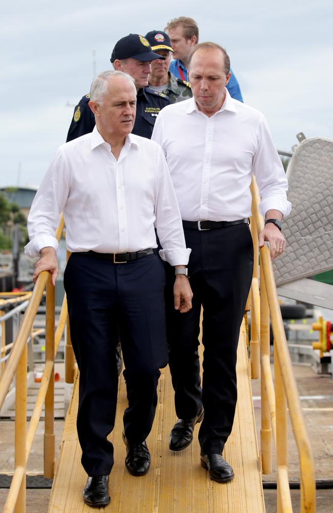 Prime Minister Malcolm Turnbull and Immigration Minister Peter Dutton leave the Australian Border Force ship the Cape St George after meeting the crew on board in Cairns. Picture: Marc McCormack