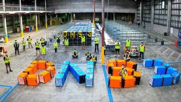 Workers inside the new Amazon Australia delivery station in Rodborough Rd, Frenchs Forest spell out the codename for the centre, DNS3 (Delivery Centre 3 NSW). Picture: Amazon Australia