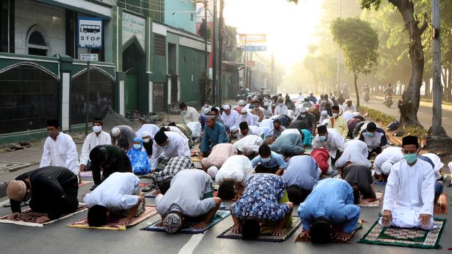 Muslims perform Eid prayers on a Jakarta street in July. Picture: Dasril Roszandi/Anadolu Agency via Getty Images